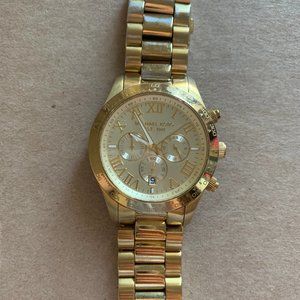 Oversized gold women's Michael Kors watch